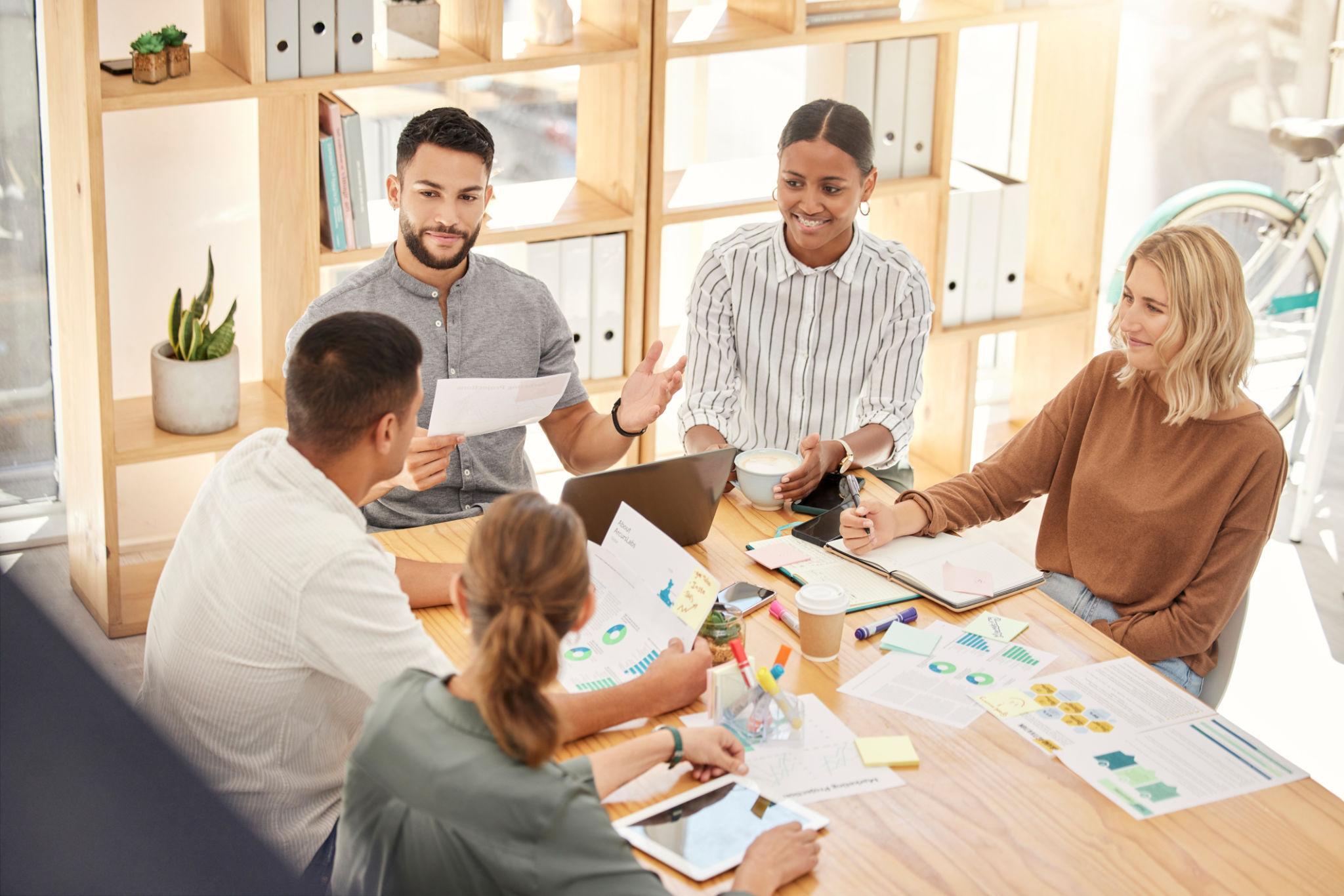 Planning, strategy and collaboration with business people in meeting for project management, marketing and analytics. Teamwork, growth and goals with employee in workshop and documents for consulting