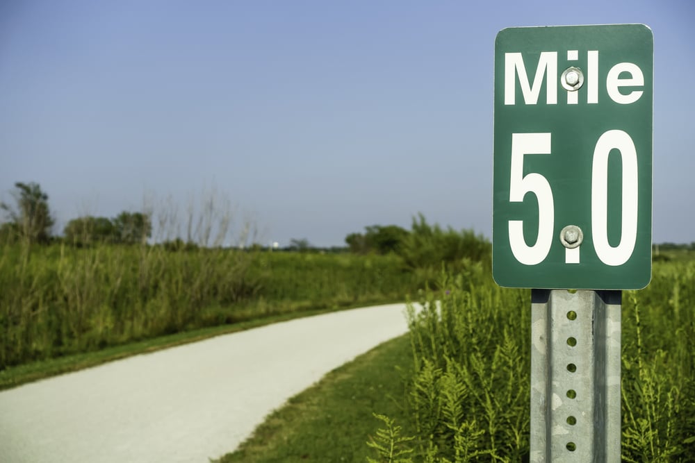 Marker at mile 5 by gravel path