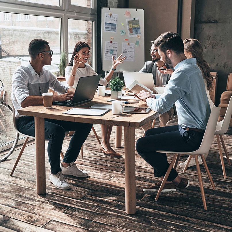 team-meeting-around-table-in-modern-office
